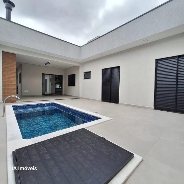casa com piscina cond olivio (8)